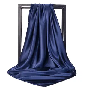 Elegant navy blue satin square scarf for styling, performance or sun protection.