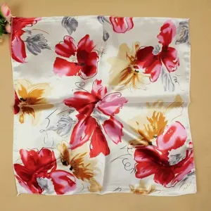 Close-up of elegant floral square scarf with artistic red and yellow blossoms