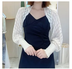 Detail view of white honeycomb lace knitted shrug for sun protection and layering