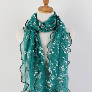 Elegant green floral print long scarf with ruffled lettuce edge detail for women.