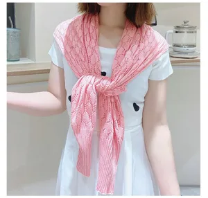 Detailed view of pink honeycomb knitted shawl for women's sun protection and styling.