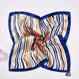Close-up of a multi-colored striped silk square scarf with a blue border in a swirl