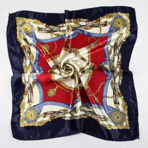 Close-up of elegant silk square scarf with vintage belt and chain pattern design