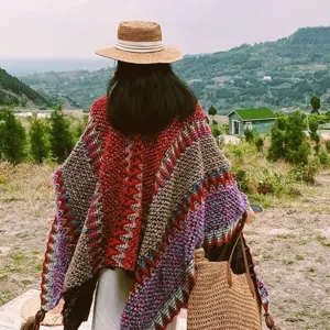 Bohemian ethnic style oversized knit poncho shawl with colorful stripe patterns for travel