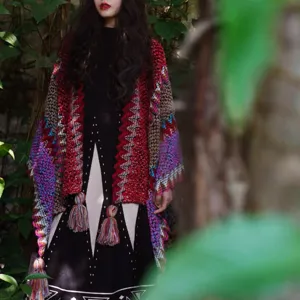 Ethnic bohemian style chunky knit shawl with colorful geometric patterns and tassels