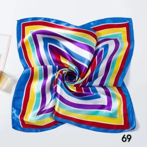 Detailed macro view of a colorful striped satin square scarf for elegant professional wear