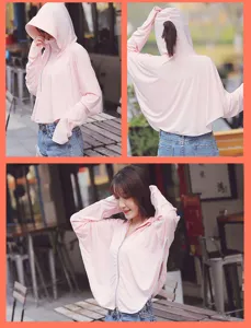 Pink ice silk sun protection hoodie for women in outdoor cafe setting