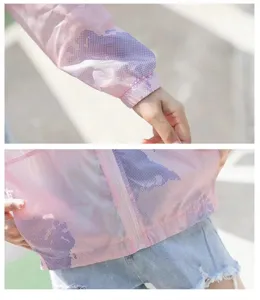 Detailed macro view of a pink breathable sun protection jacket with purple prints