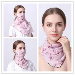 Detail of floral chiffon sun protection mask for women with neck coverage and UV protection.