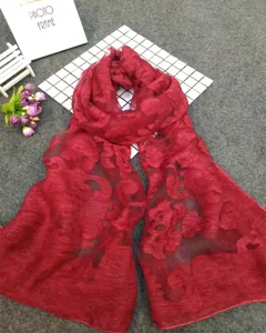 Detailed close-up of red burnout floral pattern on a lightweight ethnic style scarf