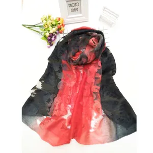 Detailed view of elegant red and black color-block lace cutout long silk scarf for women