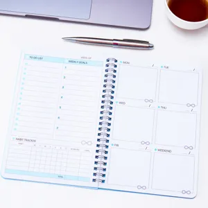 Spiral bound weekly planner notebook with habit tracker and to-do list sections