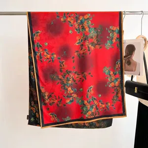 Vintage red mulberry silk scarf with vibrant orange fruit prints hanging on a rack
