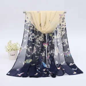 Detail view of lightweight chiffon long scarf with vibrant butterfly and floral print