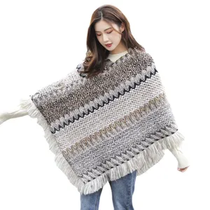 Ethnic style knitted poncho with tassels and wave pattern for autumn and winter