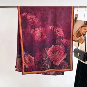 Detail view of a vintage mulberry silk scarf with peony print and hand-rolled edges.