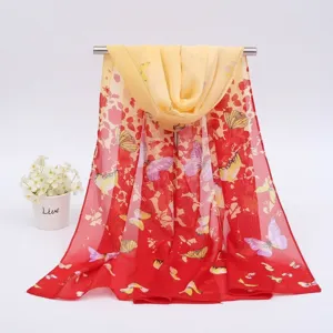 Elegant red and yellow chiffon scarf featuring vibrant butterfly and floral prints in detail