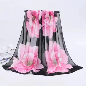 Elegant ladies long chiffon scarf featuring a vibrant pink floral print on black fabric