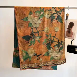 Detail view of a retro floral silk scarf draped on a rack with elegant prop accessories