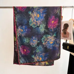 Detailed view of luxury silk scarf with vintage floral print and hand-rolled edges