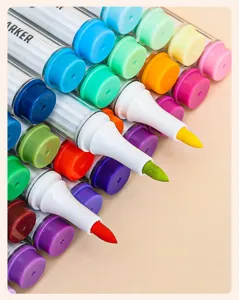 Macro detail showing soft fiber brush tips of colorful acrylic markers in vibrant shades