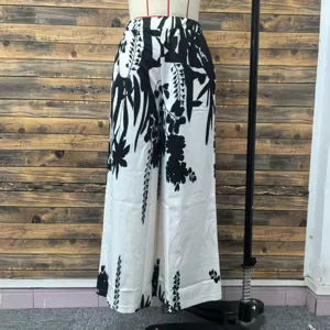 Black and white floral print wide-leg pants for women in a loose casual style.