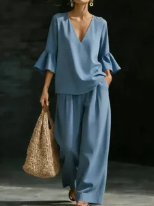 Elegant light blue cotton linen two-piece set featuring V-neck bell sleeve top and wide leg pants