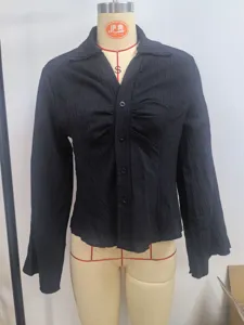 Detail shot of women's black V-neck shirt with vertical crinkle striped texture