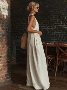 Detailed side view of an elegant white lace-trimmed sleeveless loose jumpsuit for women