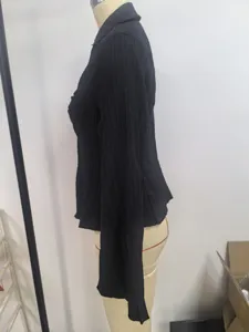 Side view of black long-sleeve women shirt with elegant vertical textured stripes