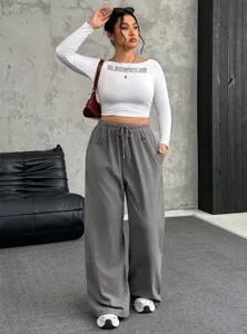 Detailed view of women's grey wide-leg drawstring waist casual loose autumn sweatpants.