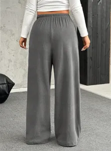 Back view of women's grey wide-leg casual pants showing relaxed fit