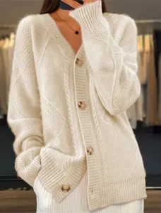 Detailed view of women's beige V-neck cable knit cardigan with button-down front