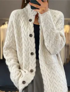 Detailed view of cream retro cable-knit cardigan with stand collar and buttons