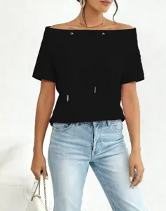 Close-up detail of a casual black off-shoulder sweatshirt with functional drawstring accents.