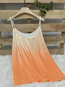 Close-up of the orange gradient color effect on a pleated summer spaghetti strap tank top