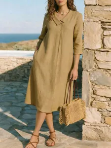 Elegante abito midi a tinta unita con revers francese, perfetto per le vacanze estive
