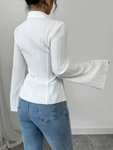 Back view of elegant white textured shirt with flared sleeves and stylish lapel collar