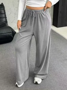 Detailed look at women's grey drawstring waist wide-leg lounge pants for a casual style