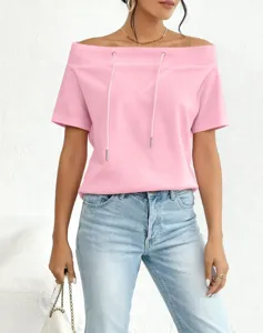Detailed view of the pink off-the-shoulder top with adjustable drawstring detail