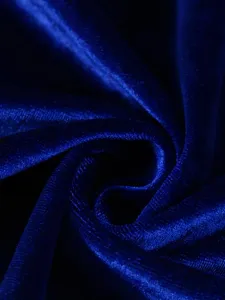 Macro detail showing the soft texture and shimmer of dark blue velvet fabric.