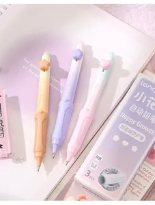 Set of three cute pastel mechanical pencils with decorative charms and soft grips