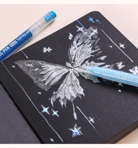 Close-up of a silver butterfly drawing on black paper using a 1.0mm glitter gel pen