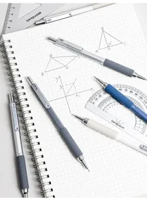 Professional mechanical pencils shown with geometric tools on a spiral math notebook.