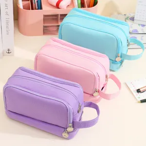 Large capacity double-layer pencil cases in purple, pink, and blue for students.