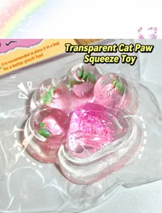 Detailed macro view of a transparent pink cat paw squeeze toy with strawberry inclusions.