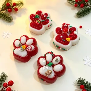 Detail view of festive cat paw squishy toys with Christmas-themed decorations