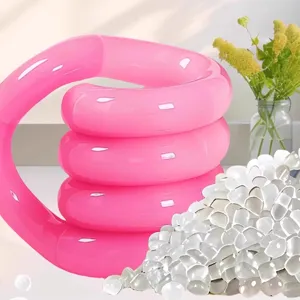Detail showing glossy pink twist decompression fidget toy with transparent water gel beads