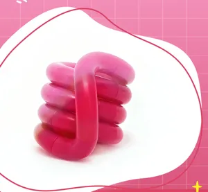 Close-up of pink heat-sensitive color-changing twist fidget toy for stress relief