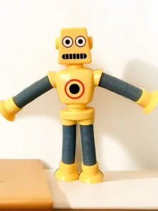 Nahaufnahme eines gelben Roboters mit ausziehbaren Armen und Saugnapf-Händen